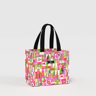 A small structured tote bag with a geometric grid print featuring holiday motifs in pink, green, red, and white, with short black webbing handles, photographed against a white background.